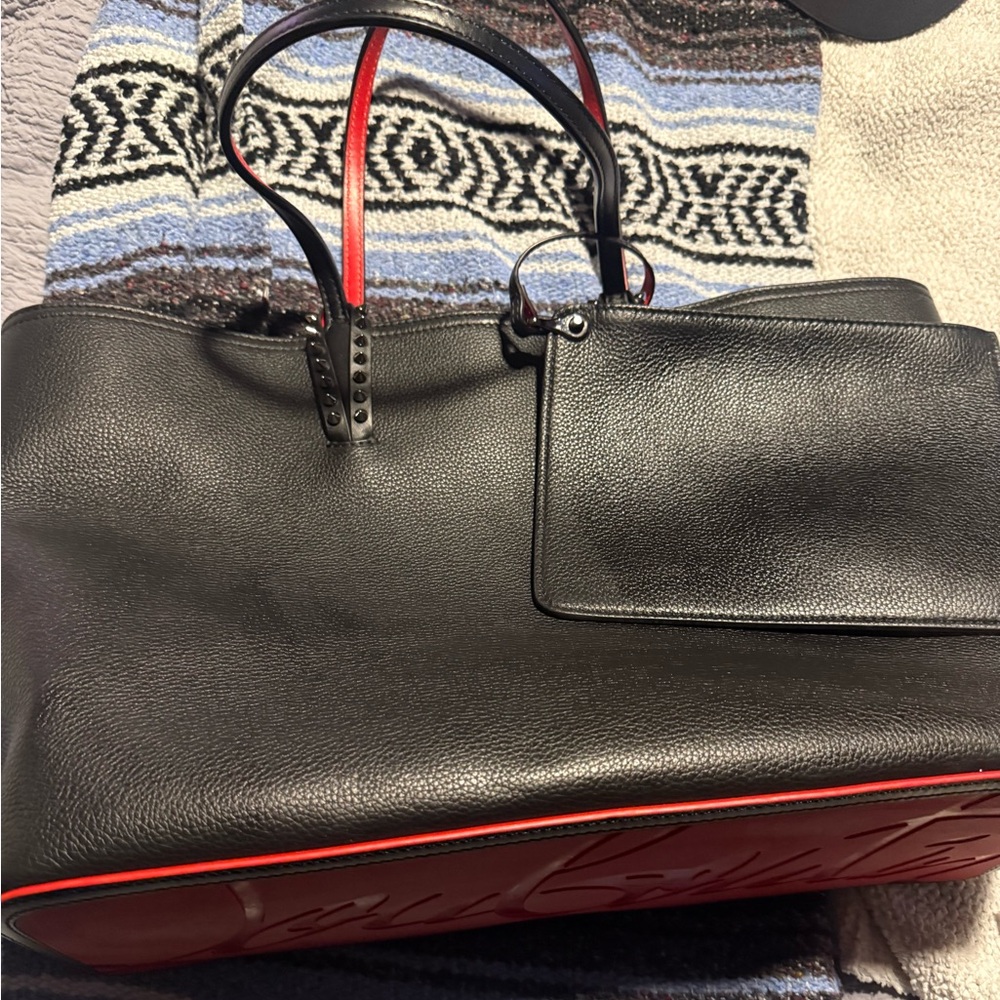 Original owner of this beautiful Louboutin Caba handbag.